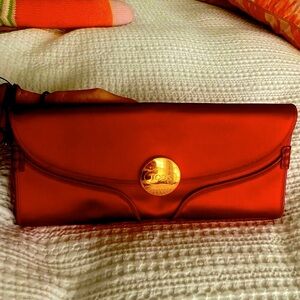 Tods red satin clutch with soft leather interior